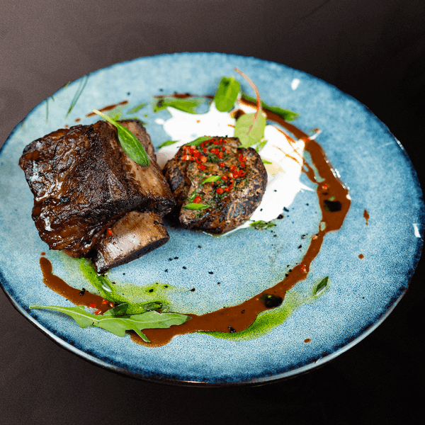 Rib with baked potatoes and sour cream